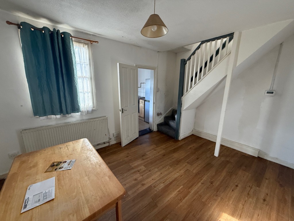Lot: 11 - END-TERRACE HOUSE FOR IMPROVEMENT - Dining Room with window to rear and stairs to first floor